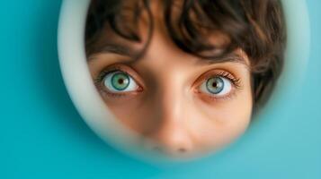 Closeup of a person admiring themselves in a mirror with a self satisfied expression photo