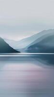 A calm lake nestled between mountain ranges, bathed in morning mist photo