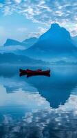 Red boats on a calm lake with a majestic mountain in the background photo