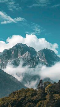 Mountain range with clouds and fog photo