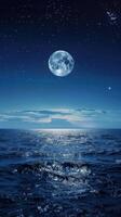 Moonlit night at sea, waves glow in soft light photo