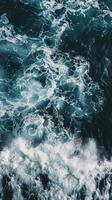 Ocean waves crashing with foam and turquoise water photo