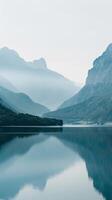 Mountains reflected in a peaceful lake photo