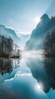 Misty morning on a serene lake surrounded by mountains photo