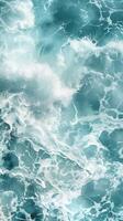 Sparkling ocean water with white foam photo