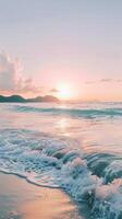Soft sunset light bathes a sandy beach with gentle waves lapping ashore photo