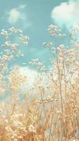 White wildflowers stand tall against a blue sky with fluffy clouds photo