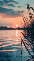 Sunset sky reflecting in calm water photo