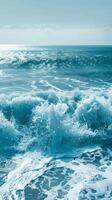 Ocean waves crashing and churning, creating a white foamy surface photo