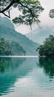 Mountain lake with misty clouds photo