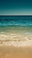 Gentle waves lap against a sandy shore photo