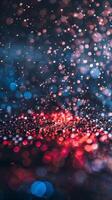 Blurry red, pink, and blue lights falling on a dark background photo