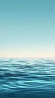 Calm, blue water stretches endlessly under a clear sky photo