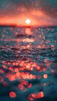 Orange sunset reflecting on rippling water photo
