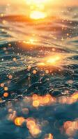 Sparkling water reflects the warm glow of the setting sun photo