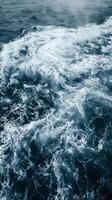 Ocean waves break and foam in the sun photo