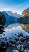 Mountain lake reflecting the early morning sky photo