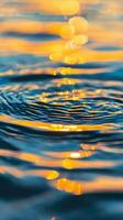 Water ripples and golden light reflect on the surface photo