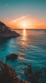 Sunset illuminates a tranquil sea with a golden glow photo