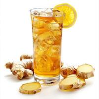 A glass of ginger ale with ice, lemon wedge, and ginger slices photo
