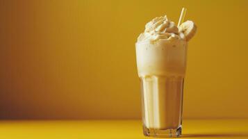 A refreshing banana smoothie with whipped cream and a banana slice garnish photo