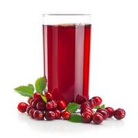 A glass of cranberry juice and fresh cranberries on a white background photo