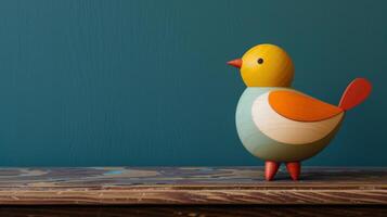 A cheerful wooden sparrow toy sits on a rustic desk photo
