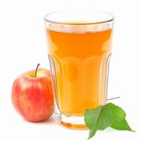 A glass of apple juice with a whole apple and leaves on a white background photo