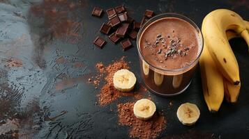 Yummy chocolate banana smoothie with shavings, cocoa powder, and fresh bananas photo