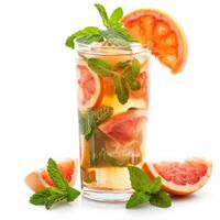 A tall glass filled with a refreshing grapefruit mint infusion beverage photo