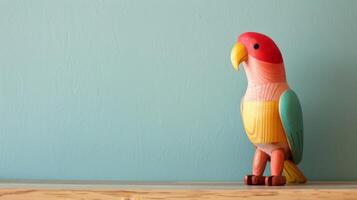 A cheerful wooden cockatoo toy stands on a desk, ready to brighten the day photo