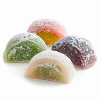 Four different mochi pastries, dusted with powdered sugar photo