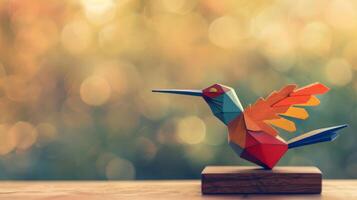 A colorful wooden hummingbird toy sits on a desk, with a bokeh background photo