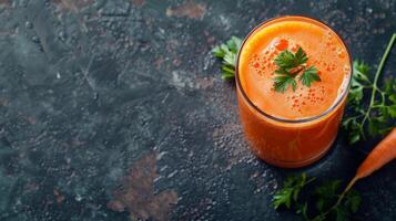 Close-up of a glass of freshly squeezed carrot juice with parsley garnish photo