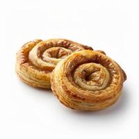 Two palmier pastries, golden brown and glistening, sit on a white background photo