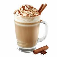 A tall glass of cinnamon latte with whipped cream and a cinnamon stick photo