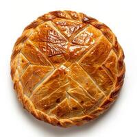 A single, golden brown galette pastry, beautifully baked with a delicate, patterned crust photo