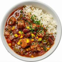 A close-up view of a bowl filled with vegetarian gumbo, white rice, and fresh herbs photo