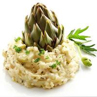 Creamy risotto topped with an artichoke heart and fresh herbs photo
