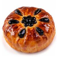 A freshly baked Eccles cake with a glossy crust and a generous filling of blackcurrants photo