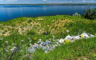 Environmental problem, pollution of the shores of a reservoir with construction and plastic waste, Khadzhibey estuary photo