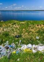 Environmental problem, pollution of the shores of a reservoir with construction and plastic waste, Khadzhibey estuary photo