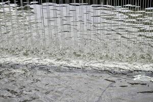 Water curtain droplets texture isolated on horizontal background. photo