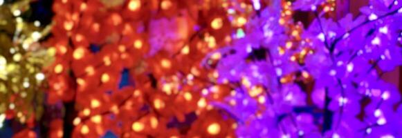 Defocused and blurry effect styled chinese oriental chinese new year vibes red, purple, and gold flower lamp texture isolated on horizontal ratio background. photo