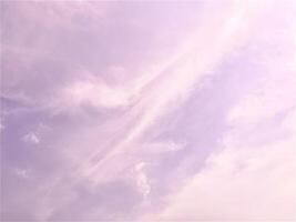 Beautiful, dreamy, romantic, and aesthetic purple colored cloudy sky isolated on horizontal ratio empty copy spaced background. photo