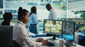 Indian call center operator gathers location and gps coordinates, monitoring traffic via surveillance camera system. Employee using CCTV real time footage to collect data. Camera B. photo