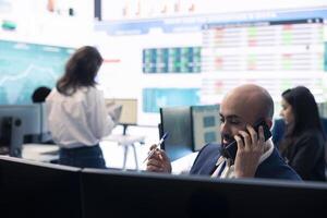 Staff member on phone call pitching an expansion idea directly to the investor, presenting key performance indicators and annual success reports in order to obtain more funds. photo