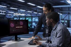 Computer scientists in server hub workspace frightened by hacker passing firewall and stealing data. Security breach notification on monitor in data center surprising IT specialists photo