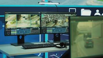 Empty government agency works on traffic radar surveillance system with CCTV security cameras, satellite reconnaissance. Observation room with computers and a big screen monitoring the public. photo