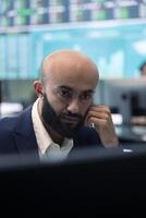 Enterprise manager analyzes annual reports and statistics on a pc, works on creating business strategies and goals. Analyst studying market dynamics and organizational progress. photo
